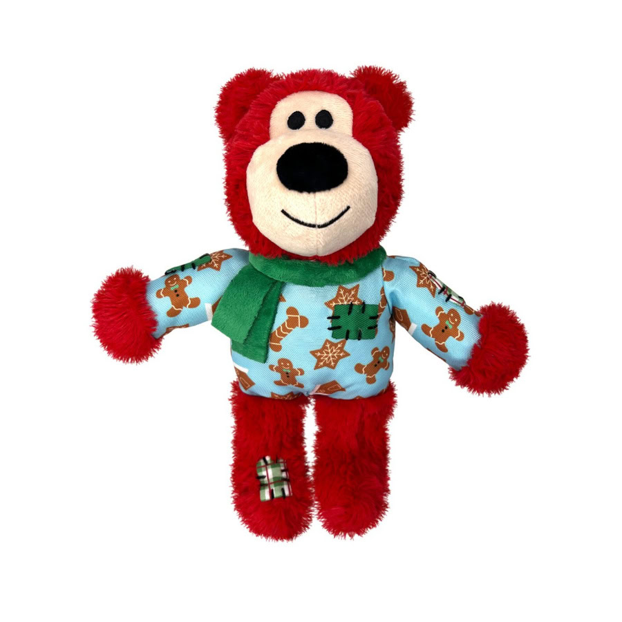 Perro jugando alegremente con el oso de peluche navideño para perros de Emperrados.